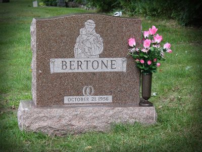 North American Pink Granite Upright Monument Bertone Memorial with Scroll Panel and Religious Carving and Wedding Date on Memorial
