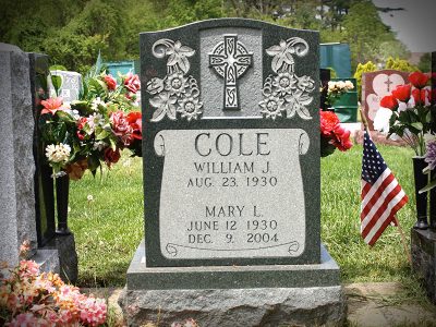 Green Granite Upright Monument Cole Memorial with Scroll Panel and Detailed Flowers with Celtic Cross Carving