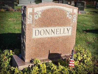 North American Pink Granite Upright Monument Donnelly Memorial with Symmetrical Cross and Flower Carving