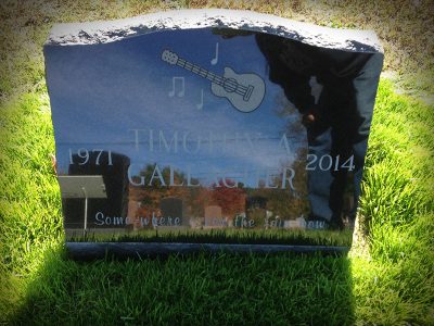 Black Granite Slant Memorial with Guitar Carving Somewhere Over The Rainbow