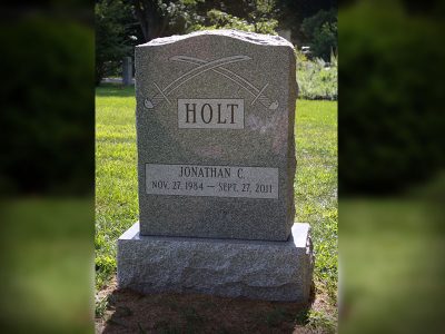 Gray Granite Upright Monument Holt Memorial with Sword Carvings