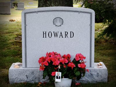 Gray Granite Upright Monument Howard Memorial Seashell Carving and Border with Black Lithochrome